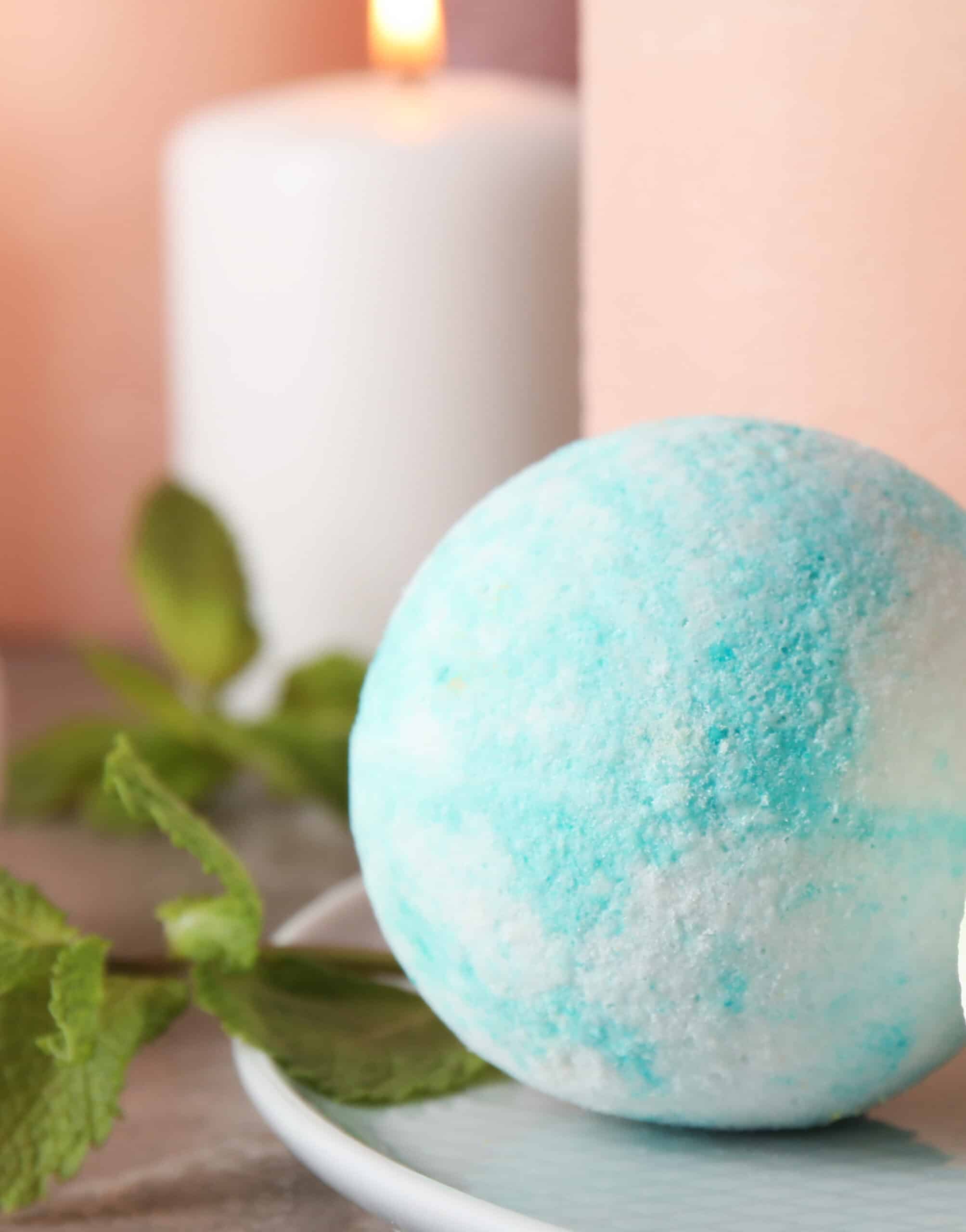 White,Plate,With,Bath,Bombs,And,Mint,Leaves,On,Table